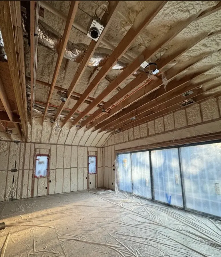 Interior walls and ceiling insulated with spray foam during new construction in Suamico